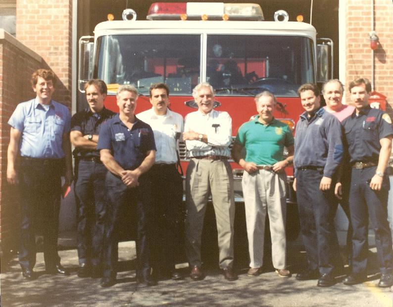 Joe McDermott commanded Platoon Two from May 1973 until his retirement at the end of September 1991.  On the final day of Platoon Two's day shift in September 1991, Chief John Tramontano escorted Cmdr. McDermott to all fire station so his guys could wish him a happy, healthy and long retirement.  Joe is now living in Branford and is still going strong.  L-R:  Capt. Dave Johnson, Ron Desroches, Bob Anthony, Cmdr. Bill Coppola, Cmdr. McDermott, Chief John Tramontano, Bill Fitzmaurice, Ed Doiron, and Jim Dunlop.  (Photo taken by Bob Macauley)
